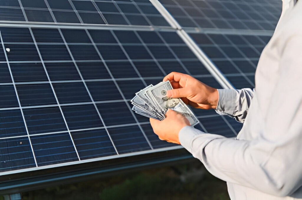 Homeowner calculating savings from rooftop solar panels, highlighting strong return on investment offered by the best solar company in Kerala.