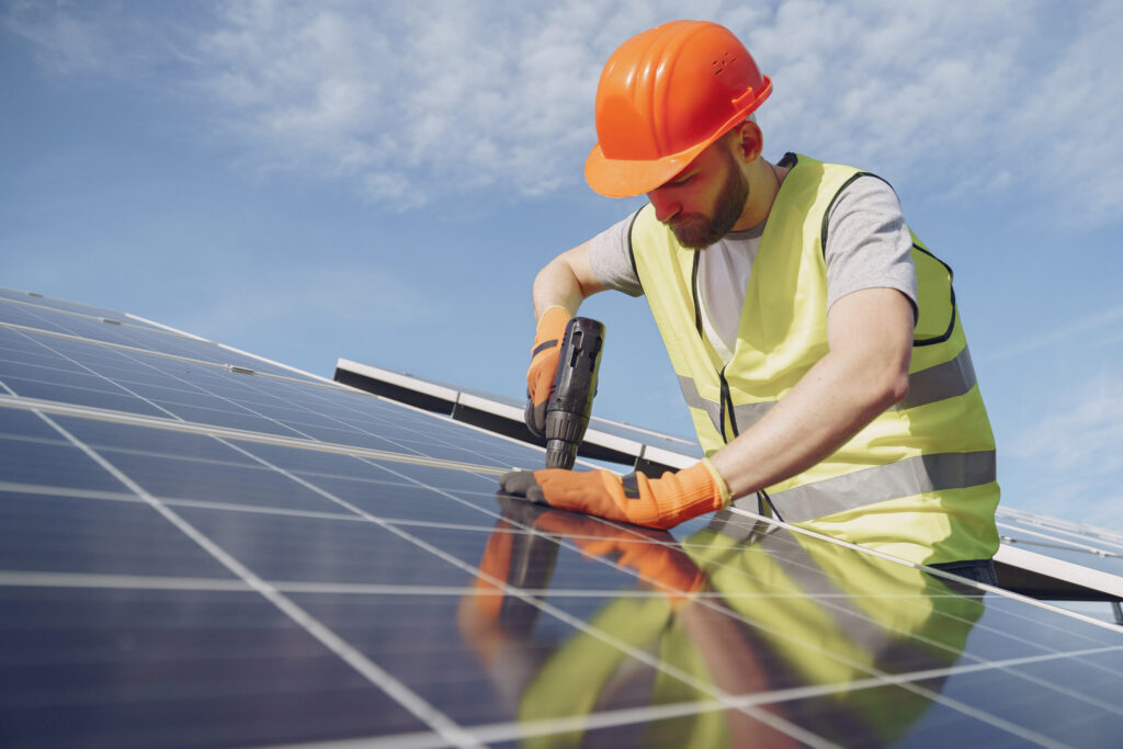 Technician installing the best solar panels in Kerala, ensuring proper setup and long-term performance with reliable after-sales service